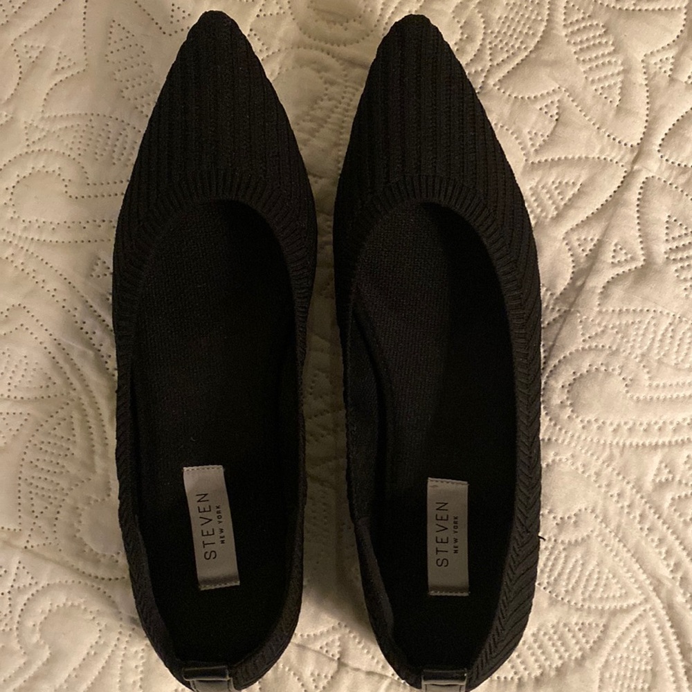 Pointed black ballet “slipper”